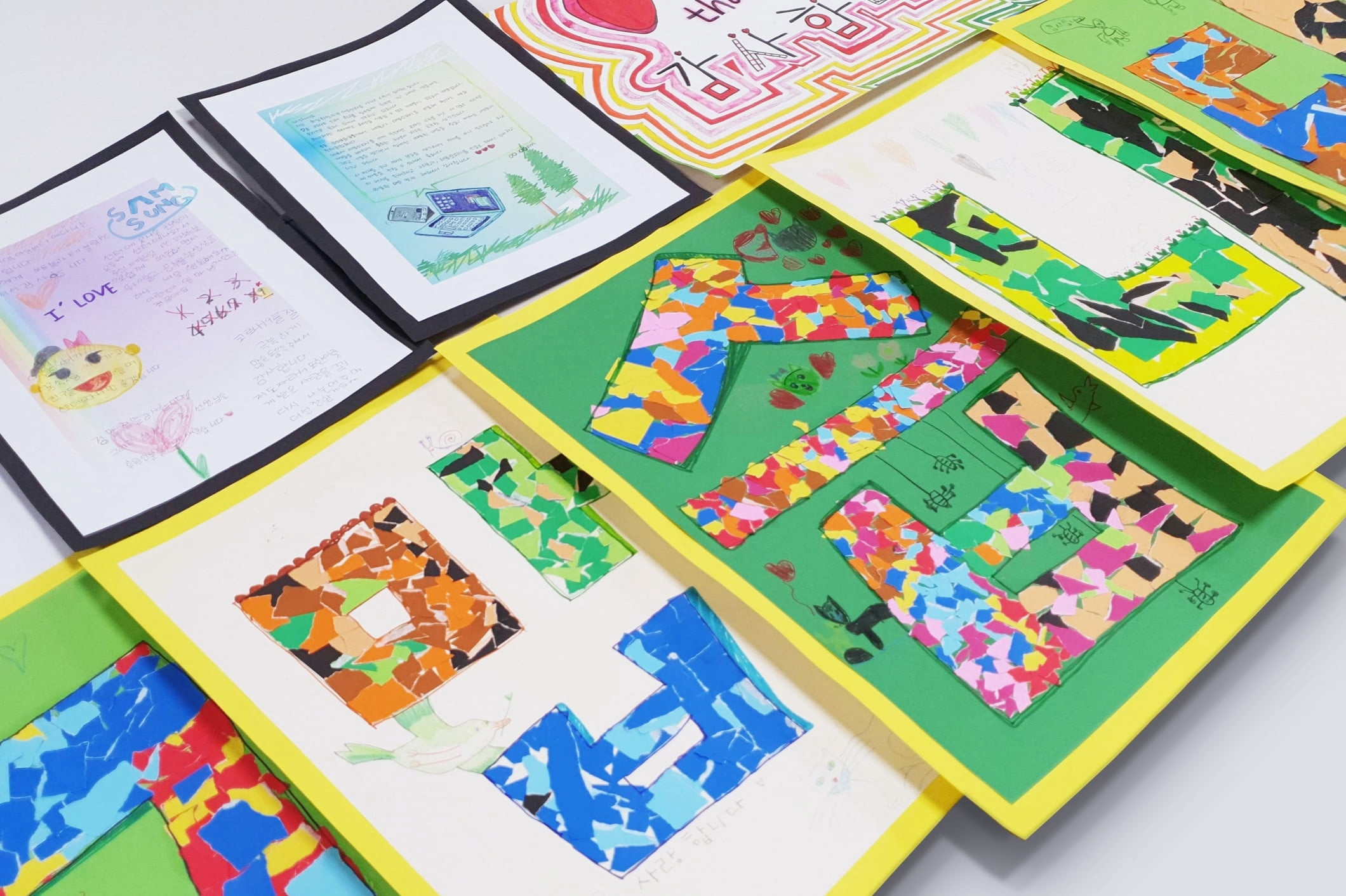 Children who have received donations from Samsung Semiconductor employees through the donation kiosk have sent in letters to say thank you. The letters when put together form the word thank you in Korean